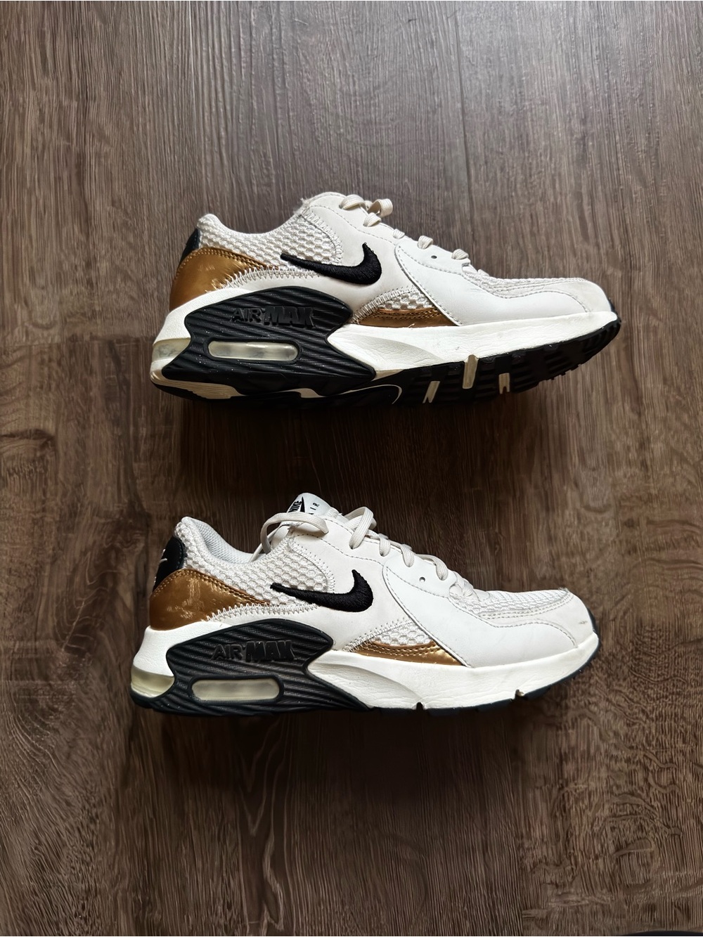 Nike White Sneakers with Gold & Black Accents